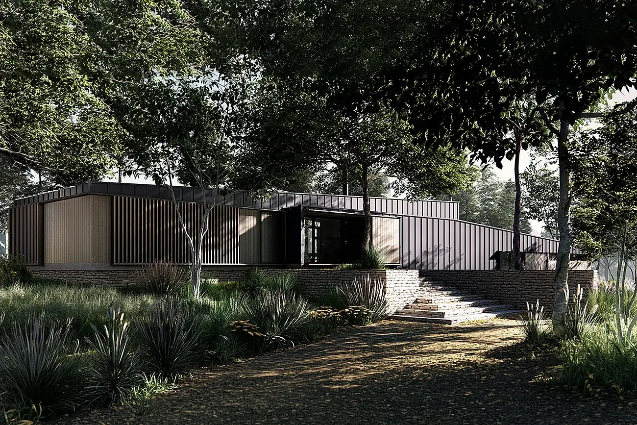 Casa Panqueco — fachada de la casa entre el bosque