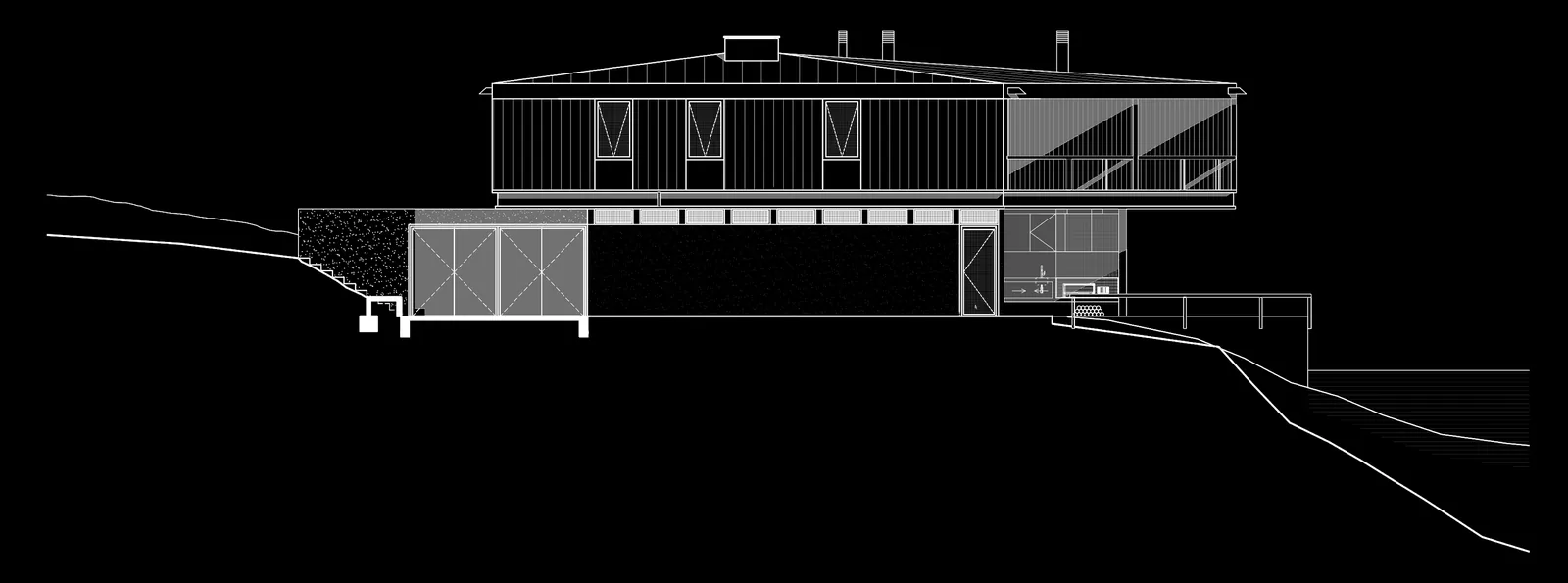 Casa Quintay — elevación sobre la pendiente